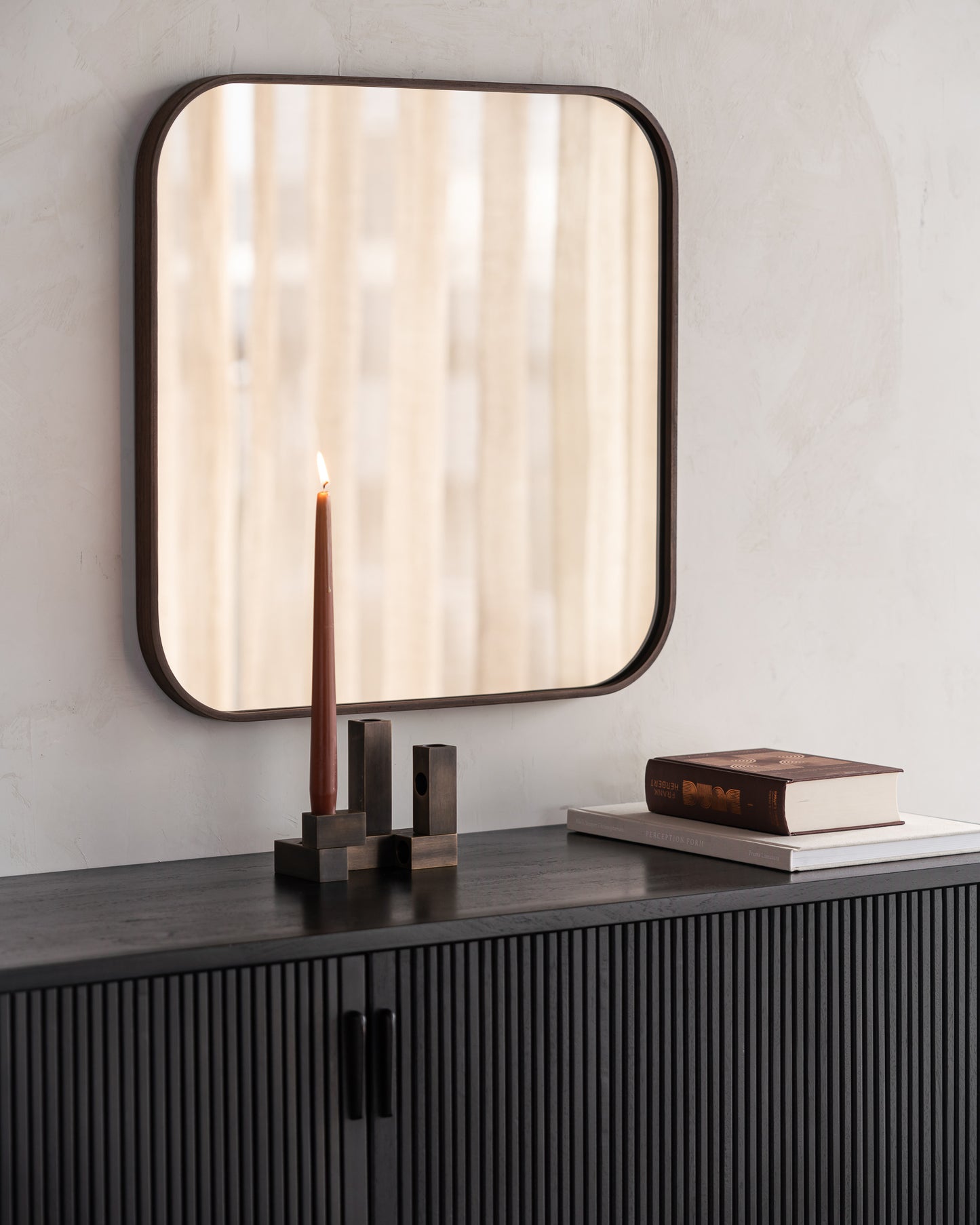 Camber wall mirror